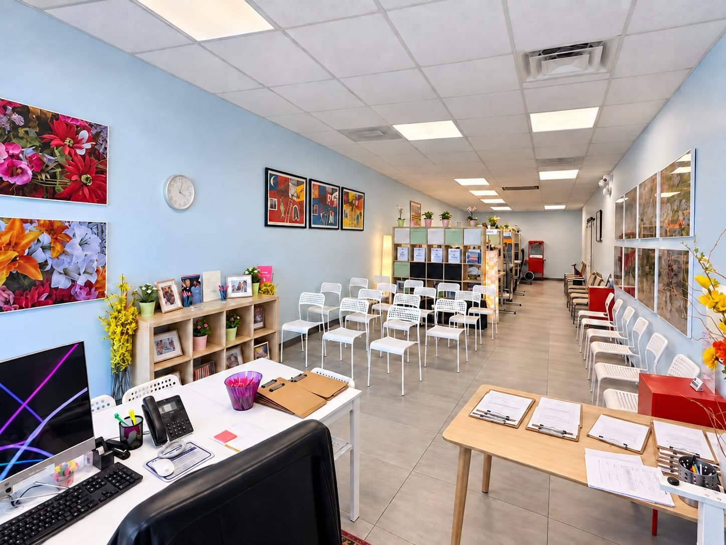 Inside Newbridge Insurance in Fort Lauderdale: a bright, light-blue office with a front desk and waiting area